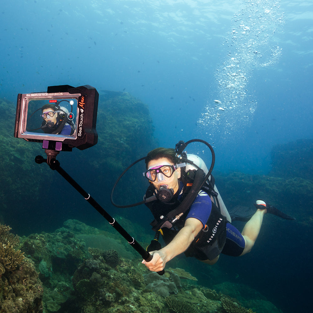 Diver using DiveVolk SeaTouch 4 Max selfie stick underwater