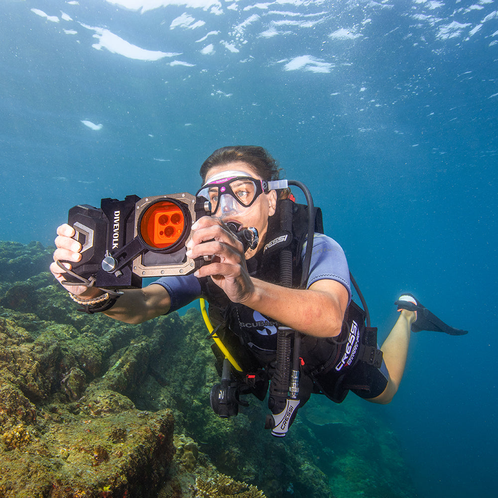 Diver using DiveVolk housing with underwater filters.